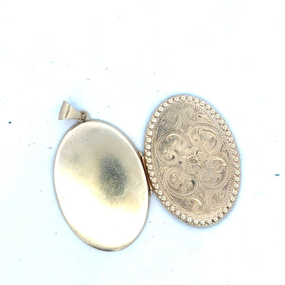 9ct yellow gold locket pendant with a polished finish, weighing 6.3g, unbranded jewelry accessory featuring intricate design.