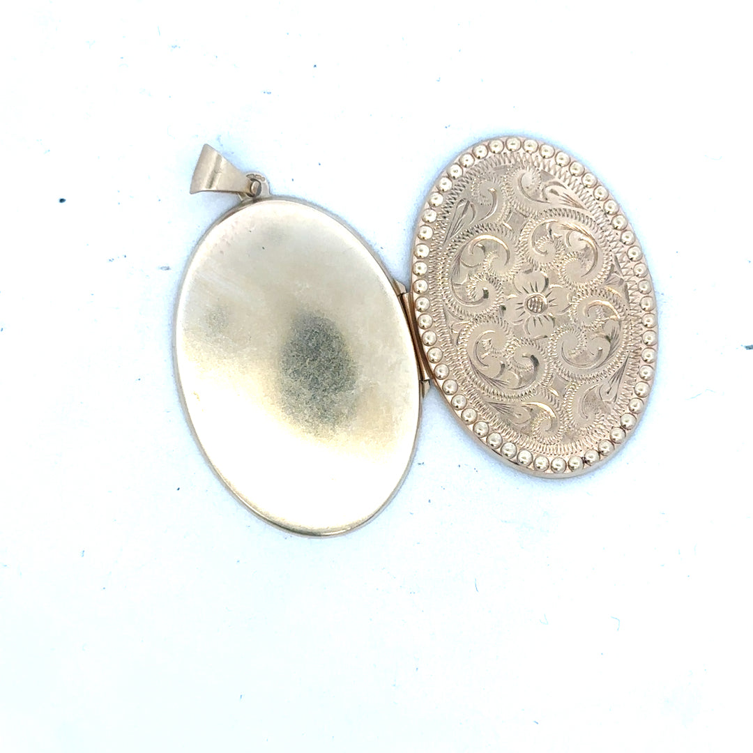 9ct yellow gold locket pendant, unbranded, featuring a classic design with a polished finish, weighing 6.3 grams.