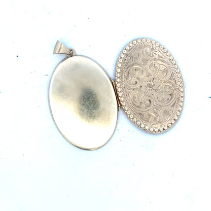 9ct yellow gold locket pendant, unbranded, featuring a classic design with a polished finish, weighing 6.3 grams.