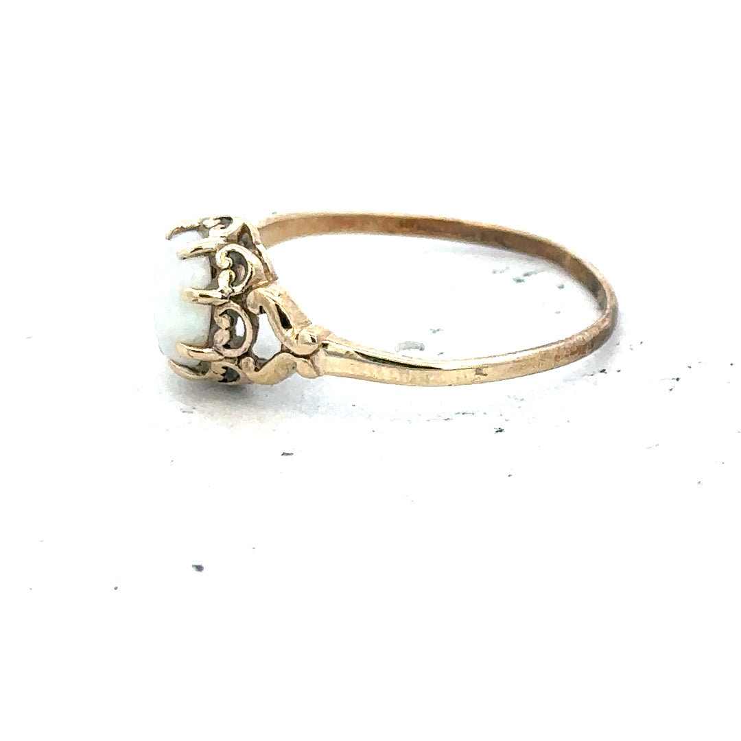 9ct yellow gold opal ring in size P with a vibrant oval opal gemstone, unbranded jewelry piece.