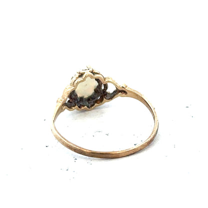 9ct yellow gold opal ring in size P featuring a vibrant oval opal gemstone on a delicate gold band.