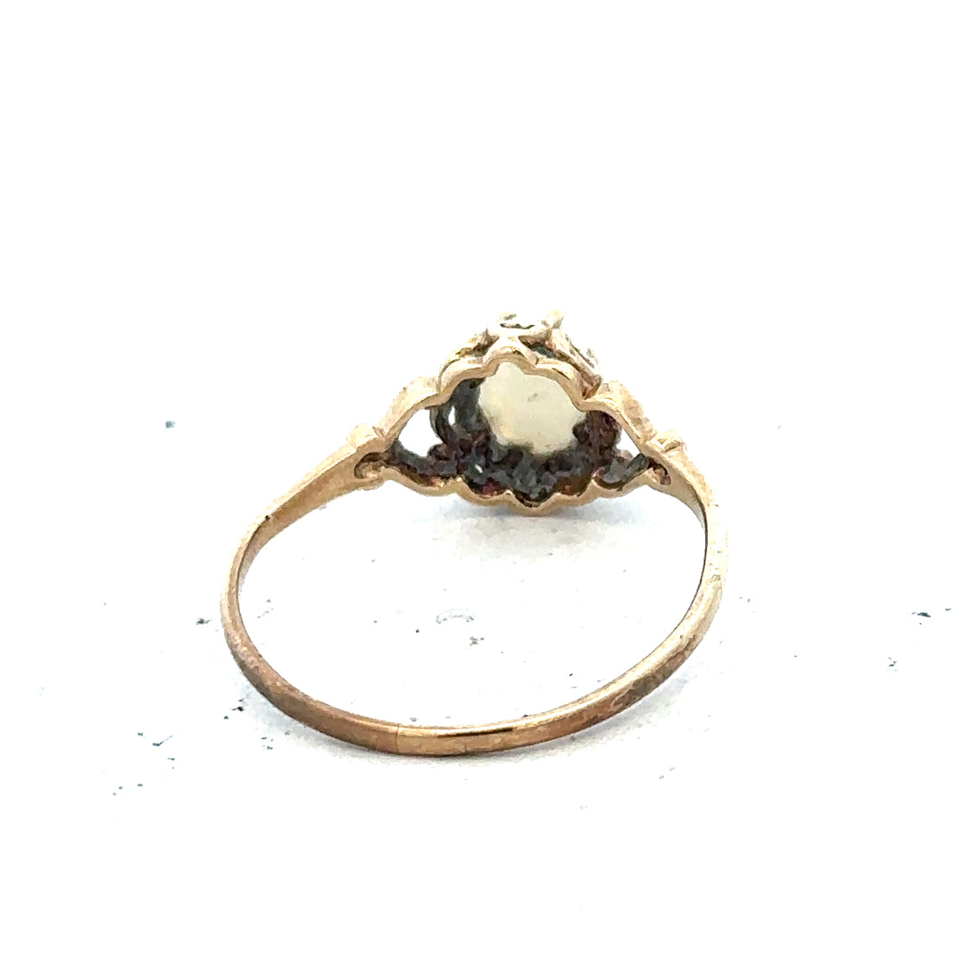 9ct yellow gold opal ring in size P with a vibrant, iridescent opal gemstone set in a simple gold band.