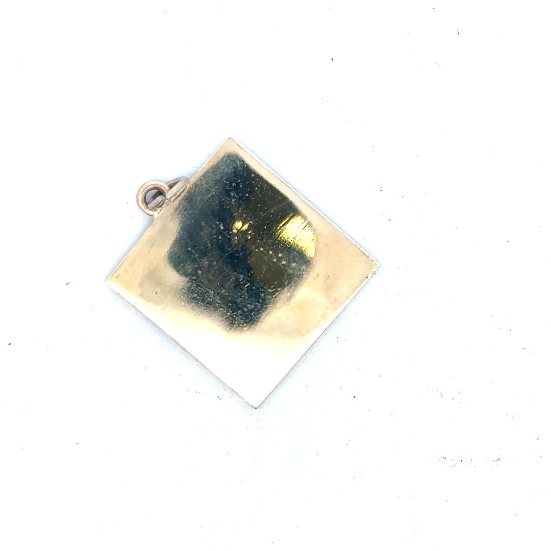 9ct yellow gold pendant weighing 9.6g, unbranded jewelry piece with a simple, elegant design, shown against a plain background.