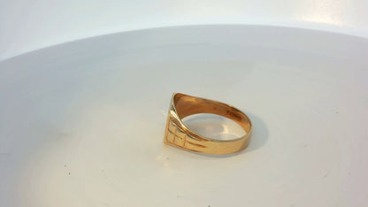 9ct yellow gold ring with smooth band, unbranded jewelry piece, showcasing a simple elegant design.