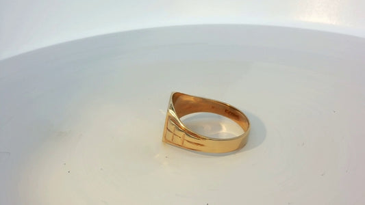 9ct yellow gold ring with smooth band, unbranded jewelry piece, showcasing a simple elegant design.