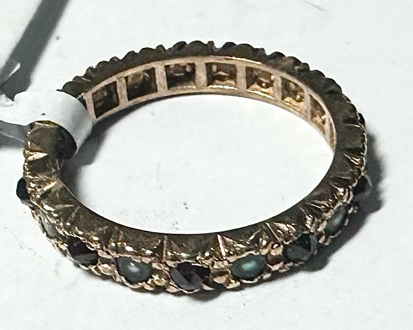 Yellow gold ring in size I1/2, unbranded 9 carat gold jewelry, close-up showing smooth polished band and gold shine.
