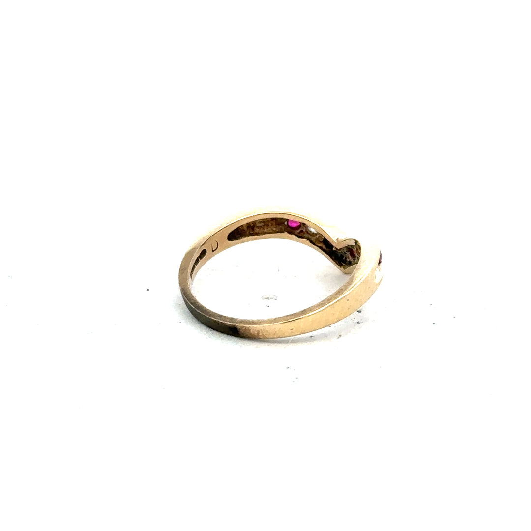 9ct yellow gold ring in size J, unbranded, with a smooth polished band, shown in a close-up view.