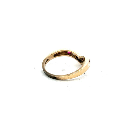 9ct yellow gold ring in size J, unbranded, with a smooth polished band, shown in a close-up view.