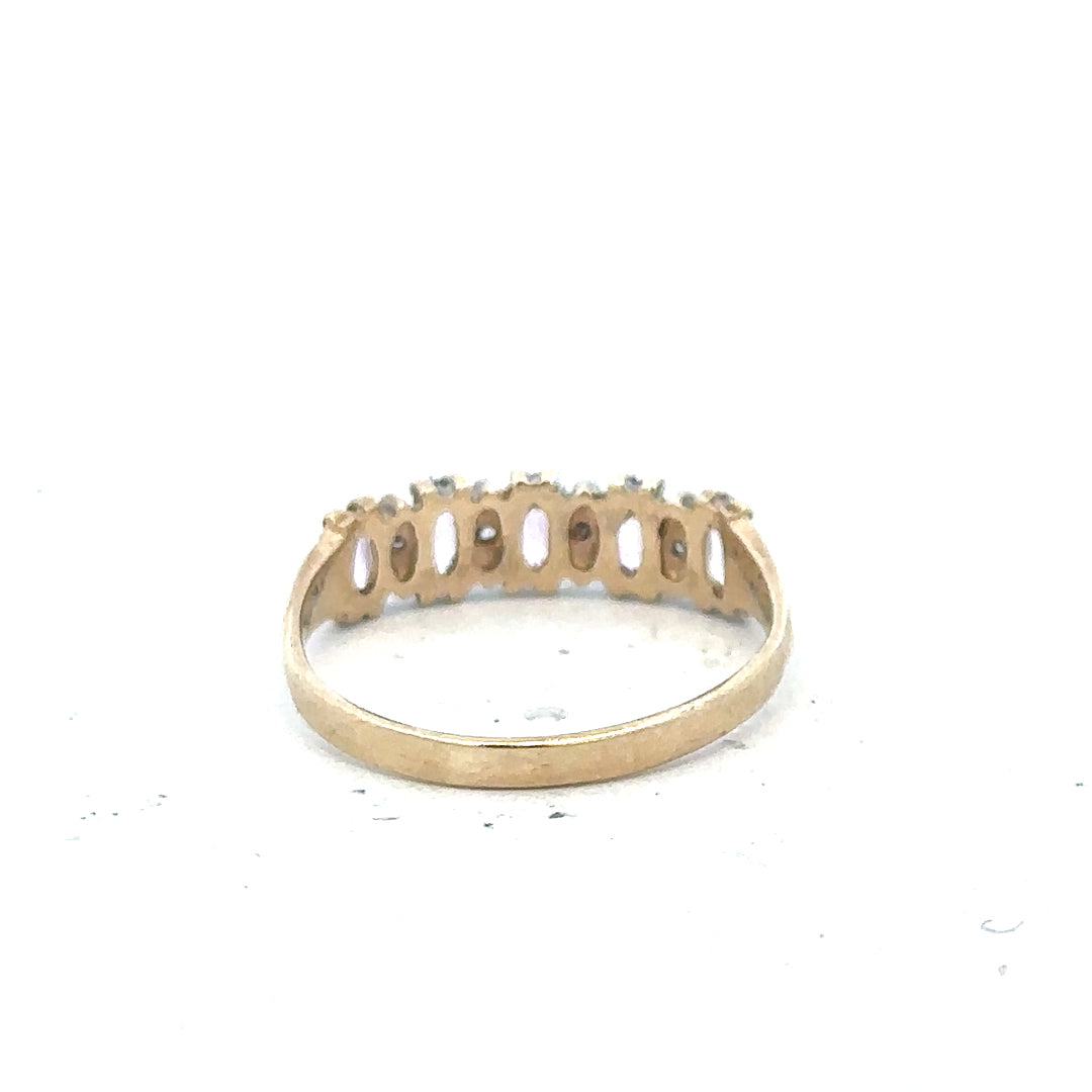 9ct yellow gold ring in size K1/2 with a simple band design, unbranded jewelry displayed on a plain background.