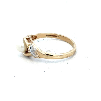 Yellow gold ring in size K1/2, unbranded, with a smooth polished finish, shown from a side angle.