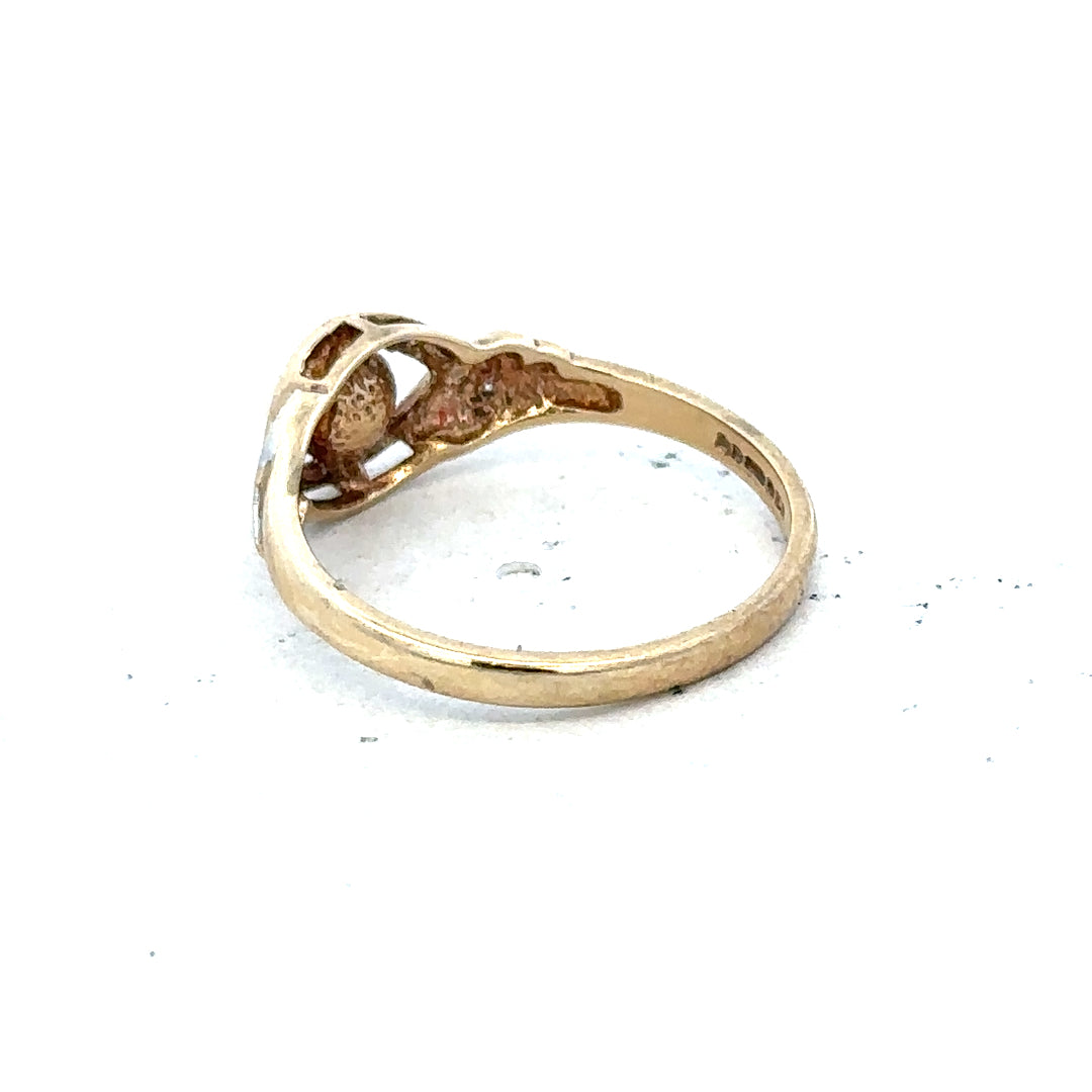 9ct yellow gold ring size K1/2 with a smooth band, unbranded jewelry, shown in a detailed close-up image.