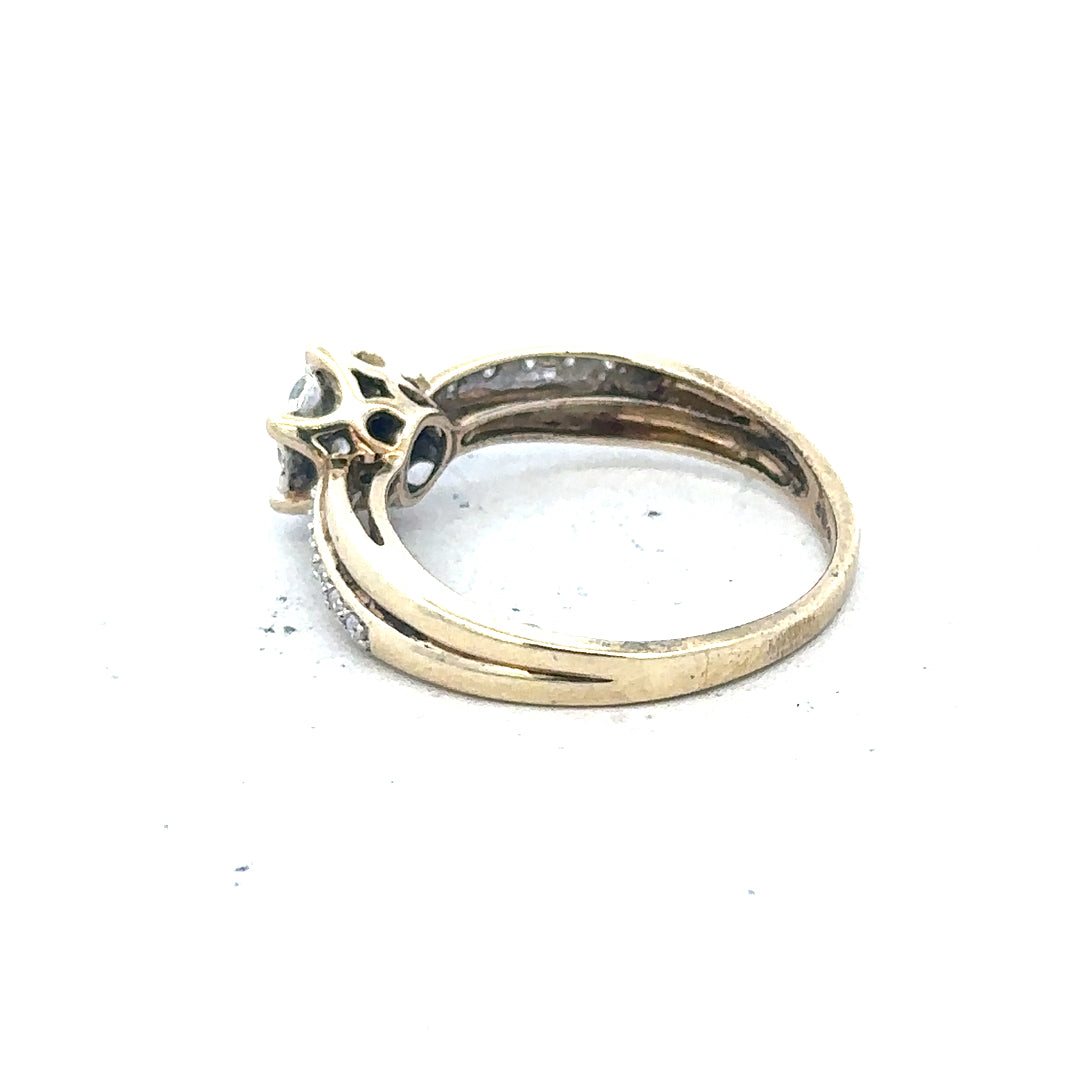 9ct yellow gold ring in size L with a simple band design, unbranded, shiny and polished surface.