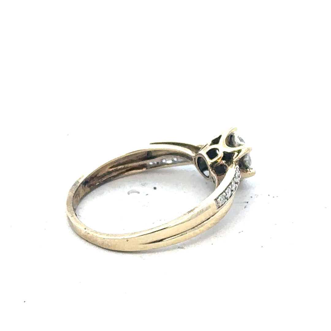 9ct yellow gold ring in size L, unbranded jewelry, close-up showing polished band and simple design.