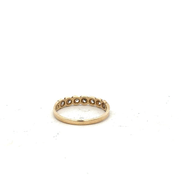 9ct yellow gold ring in size L with a smooth band, unbranded jewelry piece displayed against a neutral background.