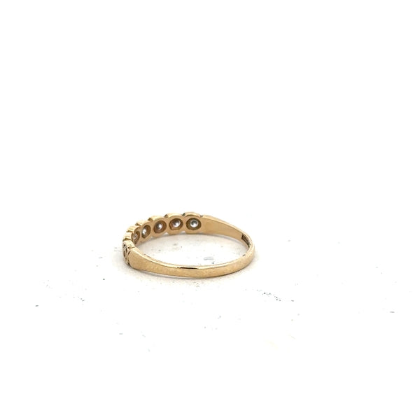 9ct yellow gold ring in size L with a smooth band, unbranded, shown from a side view highlighting its polished finish.