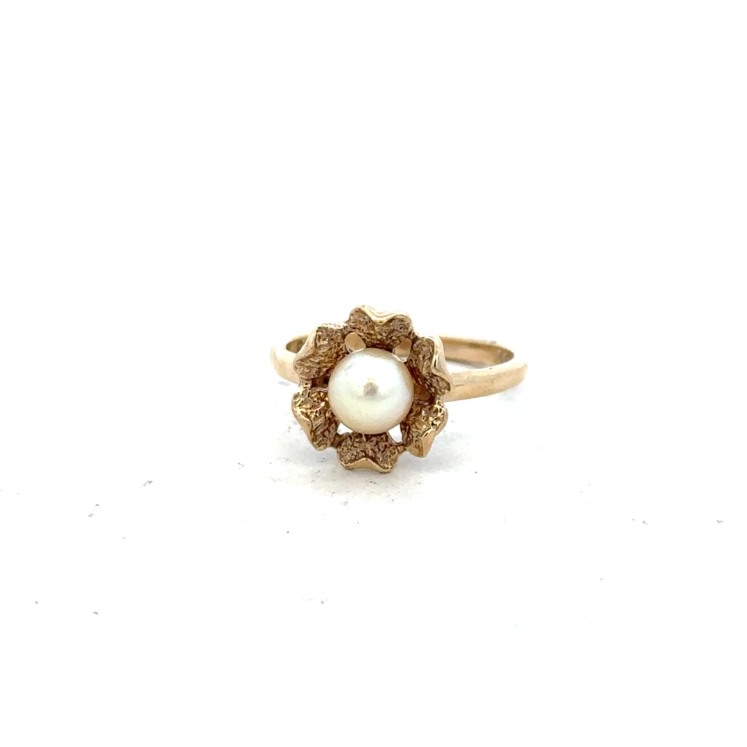9ct yellow gold ring in size L with a smooth polished finish, unbranded jewelry showcasing classic elegance.
