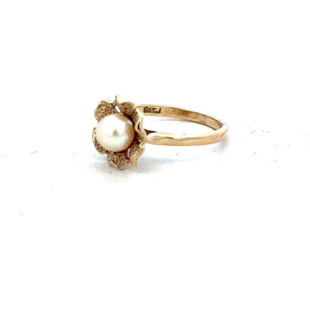 9ct yellow gold ring in size L with a smooth polished band, unbranded, showcasing a simple elegant design.