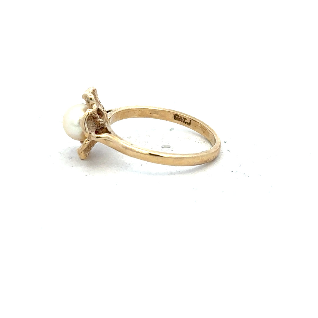 Yellow gold ring in size L, unbranded 9ct gold band with a smooth finish, displayed against a neutral background.