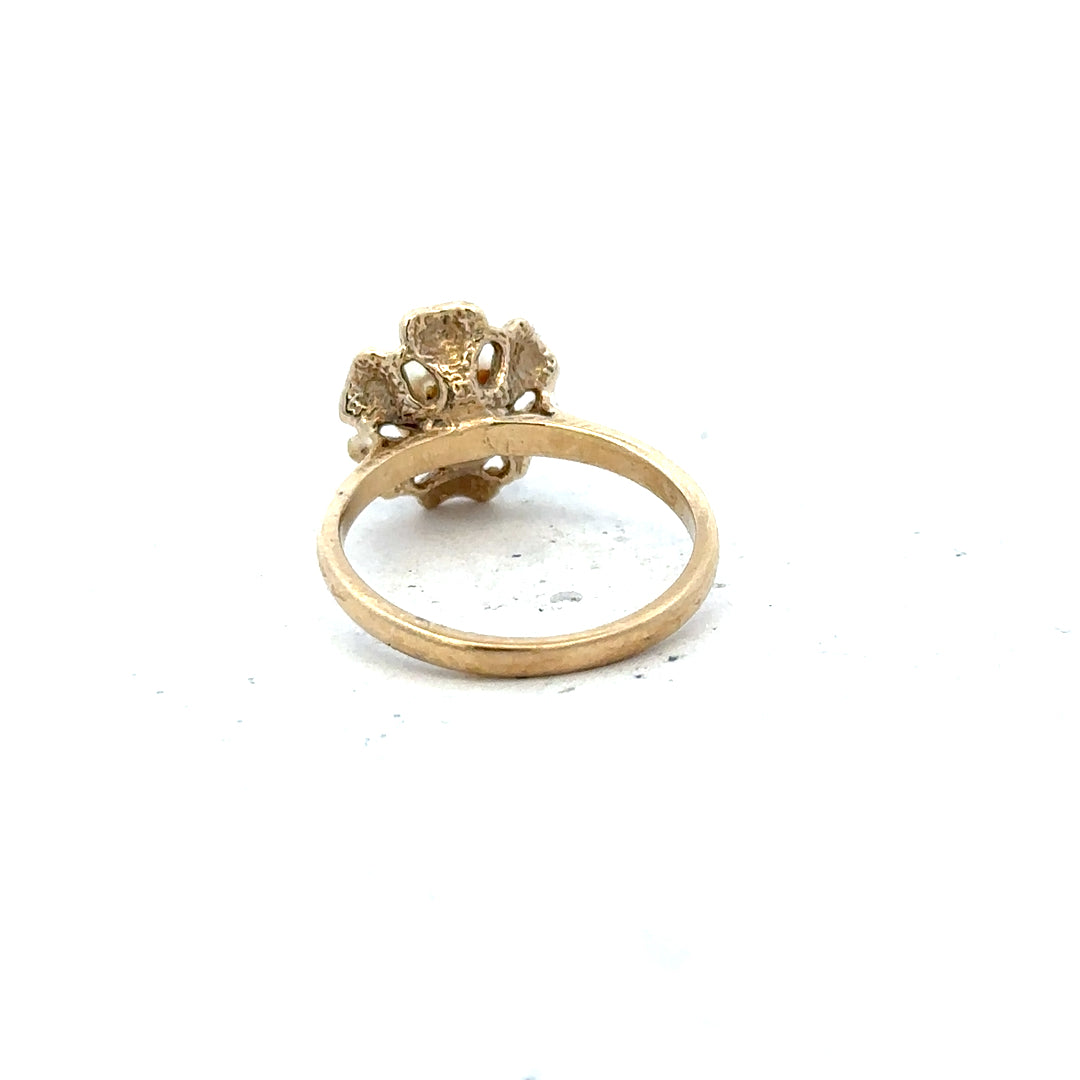 9ct yellow gold ring in size L with a smooth band, unbranded jewelry piece displayed against a plain background.