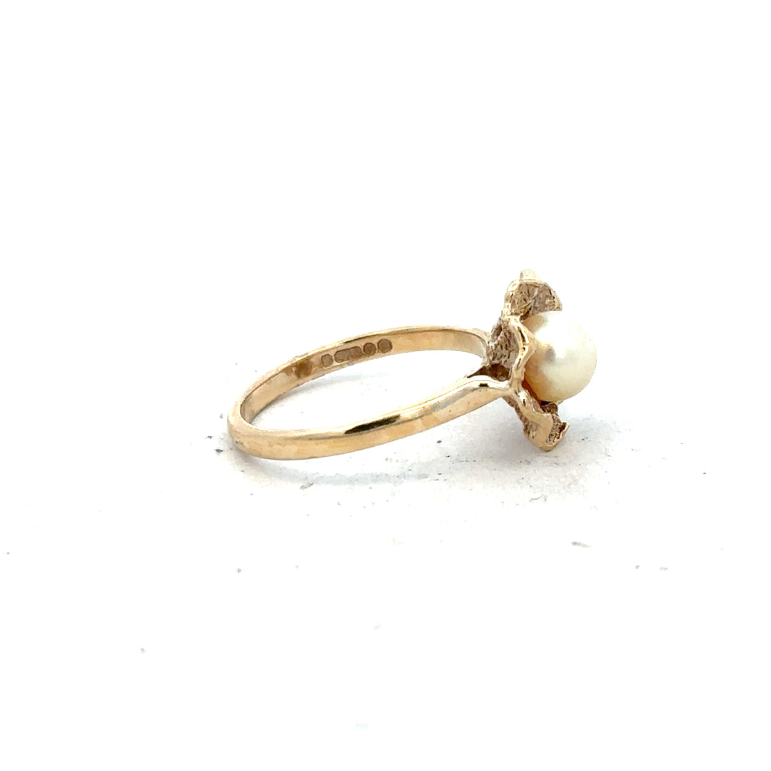 9ct yellow gold ring in size L, unbranded jewelry with a smooth band, shown on a white background.