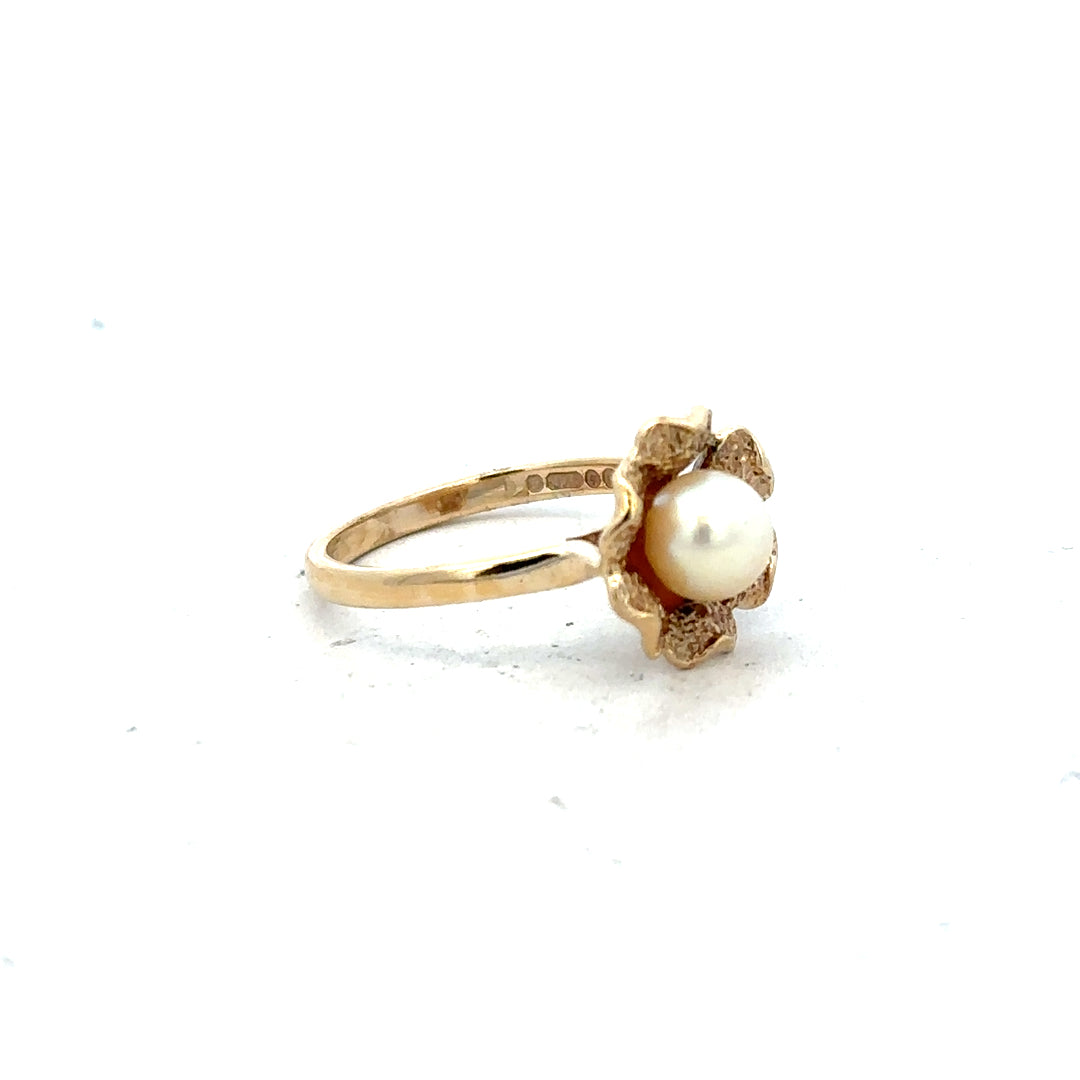 9ct yellow gold ring in size L with a smooth band, unbranded jewelry piece showcasing classic gold craftsmanship.