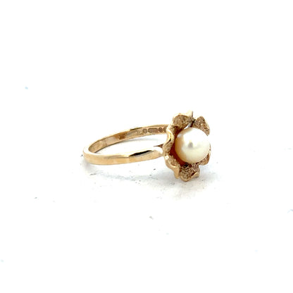 9ct yellow gold ring in size L with a smooth band, unbranded jewelry piece showcasing classic gold craftsmanship.