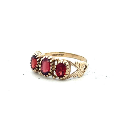 9ct yellow gold ring in size L with a simple band design, unbranded, shown in close-up on a plain background.