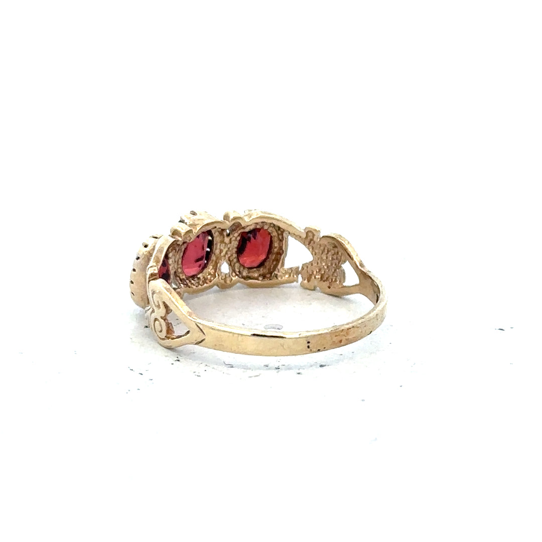 9ct yellow gold ring in size L, unbranded, showcasing a smooth polished band on a white background.