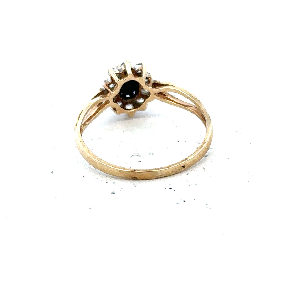 9ct yellow gold ring in size L with a smooth band, unbranded jewelry piece displayed against a neutral background.