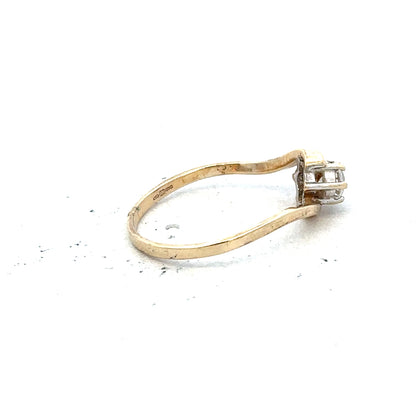 9ct yellow gold ring in size L with a smooth, polished finish, unbranded jewelry displayed on a plain background.