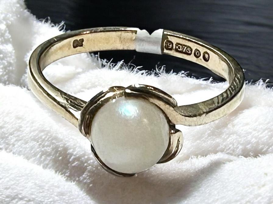 9ct yellow gold ring in size L1/2 with a smooth band, unbranded, shown on a plain background.