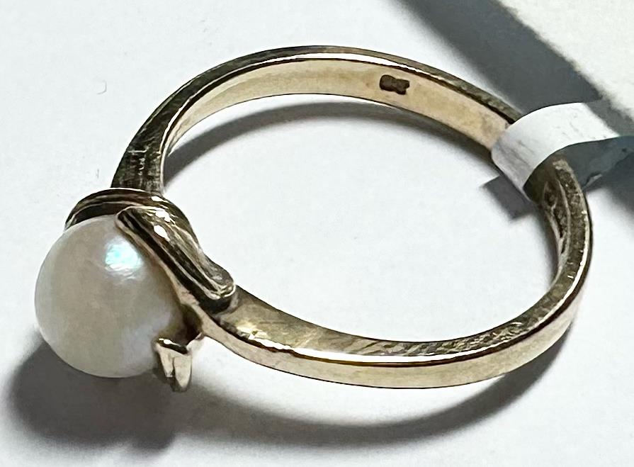 9ct yellow gold ring size L1/2 with a smooth polished band, unbranded jewelry design, shown in close-up image.
