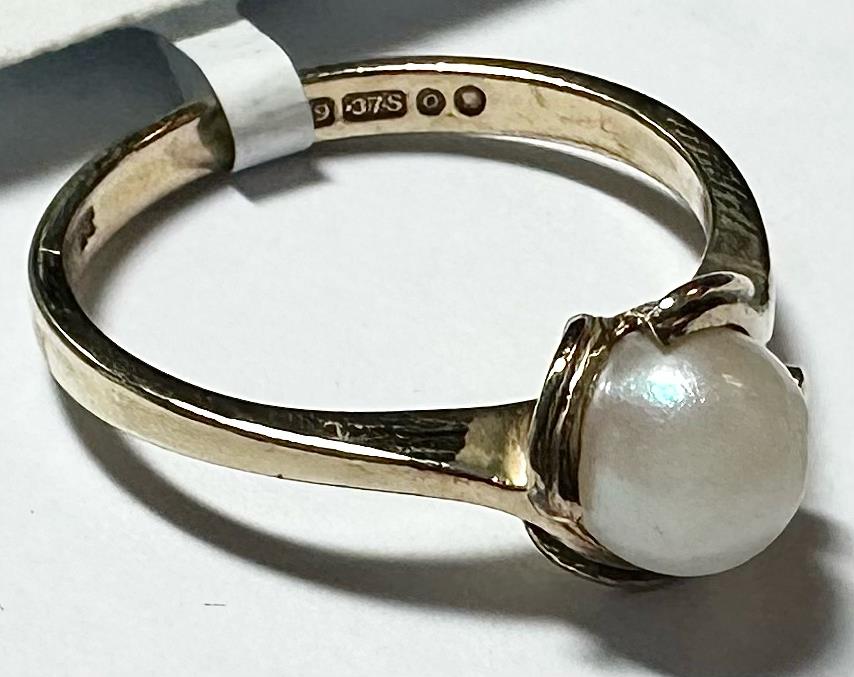 9ct yellow gold ring in size L 1/2, featuring a smooth band and polished finish, unbranded jewelry accessory.