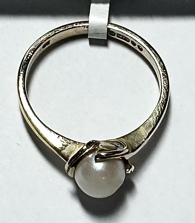 9ct yellow gold ring in size L 1/2 with a smooth band, designed for elegant everyday wear.