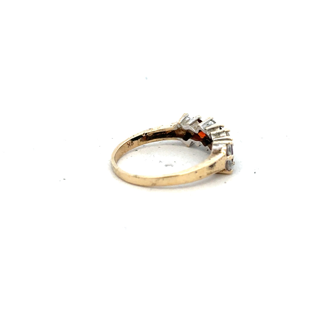 9ct yellow gold ring in size L 1/2 with a smooth band, unbranded jewelry displayed against a neutral background.