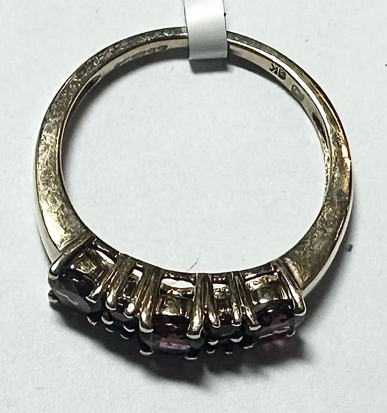 9ct yellow gold ring in size M with a smooth band, unbranded jewelry piece, displayed on a plain background