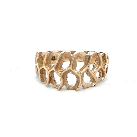 9ct yellow gold ring in size M with a smooth band, unbranded jewelry showing a close-up of the ring's polished surface.