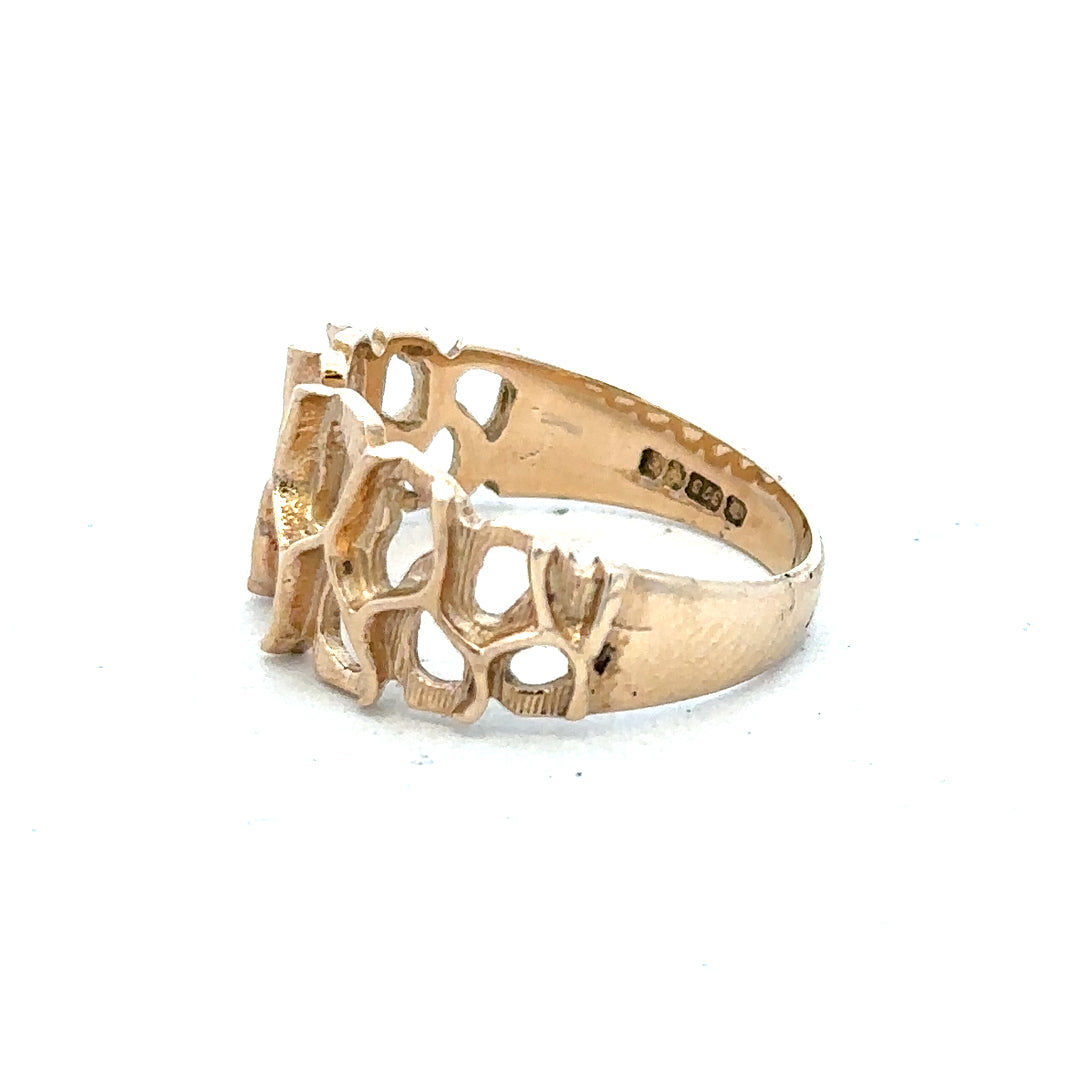 9ct yellow gold ring in size M, unbranded, with a smooth polished band, displayed against a plain background.