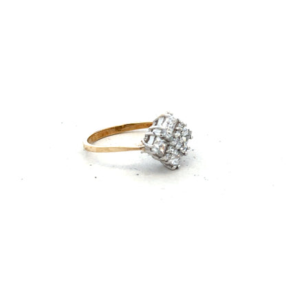 9ct yellow gold ring in size M with a smooth, polished finish, unbranded jewelry, shown from a side angle.
