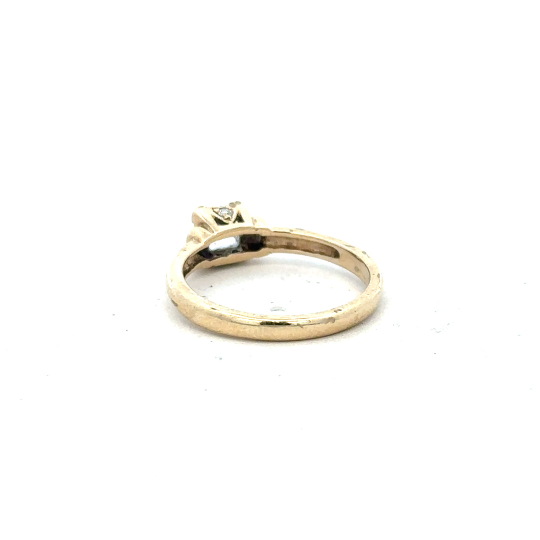 9ct yellow gold ring in size O with a simple, polished band, unbranded, showcasing a classic jewelry design.