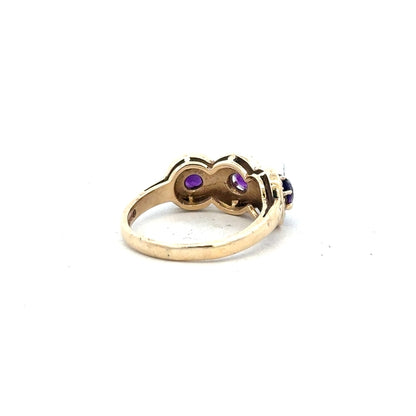 9ct yellow gold ring in size O, unbranded, with a smooth polished finish, shown from a side angle.