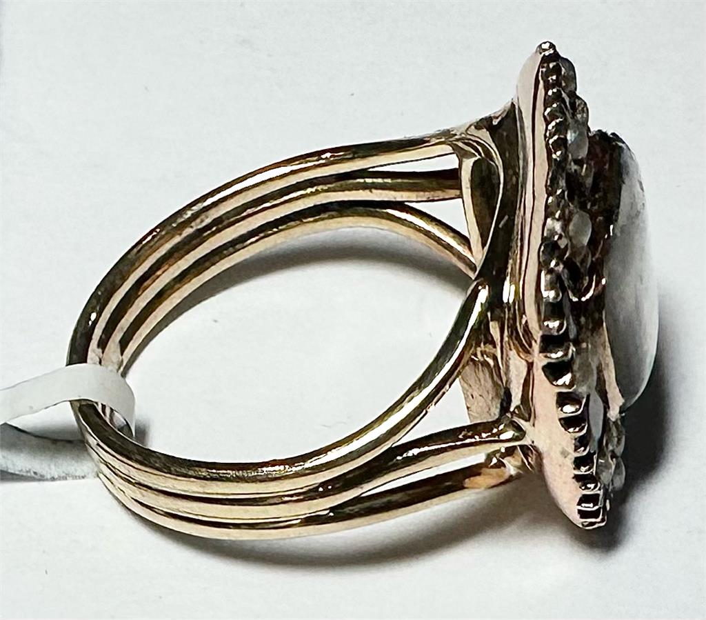 9ct yellow gold ring size O1/2 with smooth band, unbranded jewelry piece, shown from a side angle.