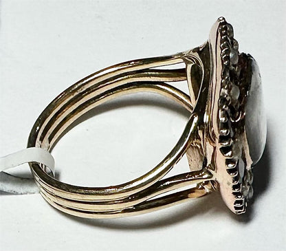 9ct yellow gold ring size O1/2 with smooth band, unbranded jewelry piece, shown from a side angle.