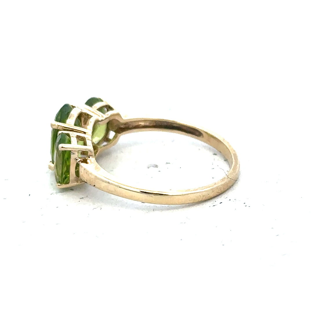 9ct yellow gold ring size P, unbranded, with a smooth polished band, shown from a side angle highlighting its elegant design.