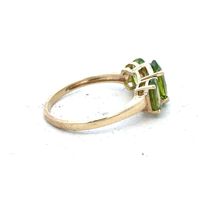 9ct yellow gold ring in size P, unbranded, showcasing a smooth polished band with a subtle shine.