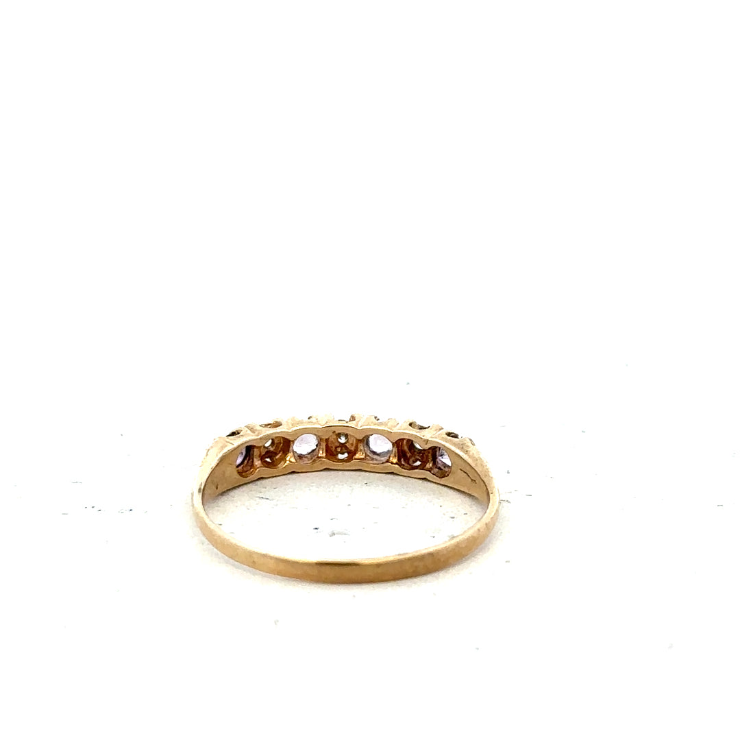 Yellow gold ring in size P with a smooth band, unbranded 9ct gold jewelry displayed on a white background.