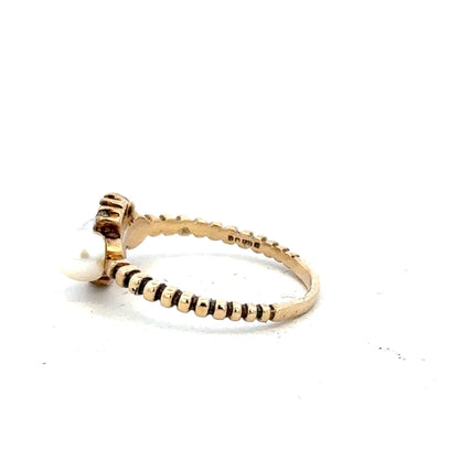 9ct yellow gold ring size P with a smooth band, unbranded jewelry piece displayed against a neutral background.