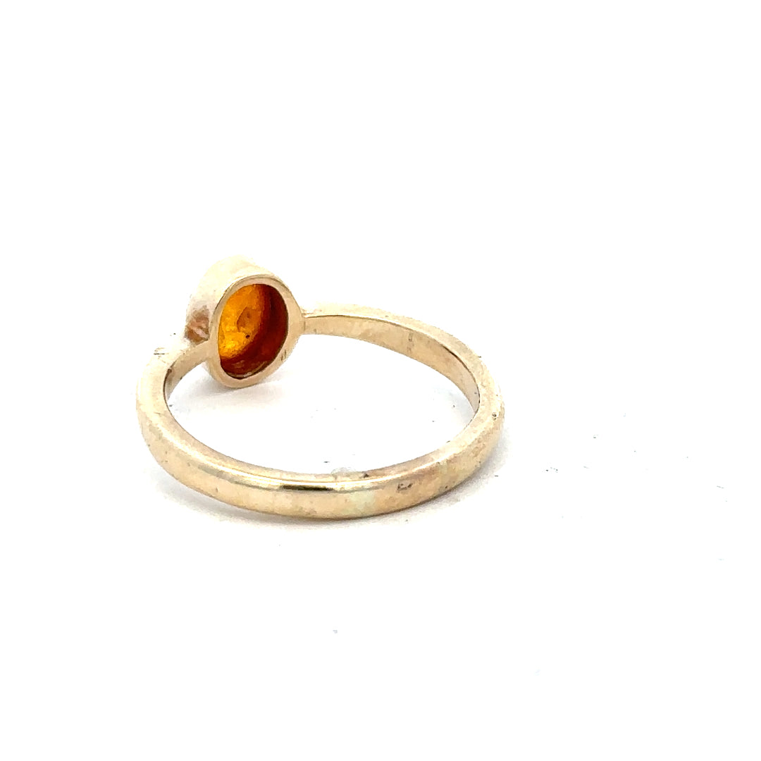 9ct yellow gold ring in size P, unbranded, showcasing a smooth band with polished finish.