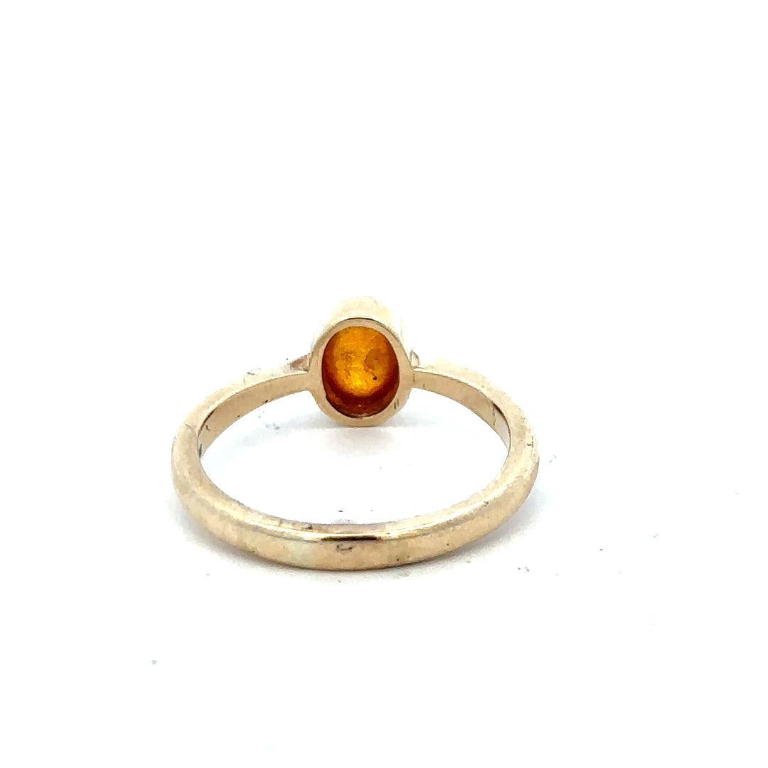 9ct yellow gold ring in size P with a simple, elegant band, displayed against a neutral background.