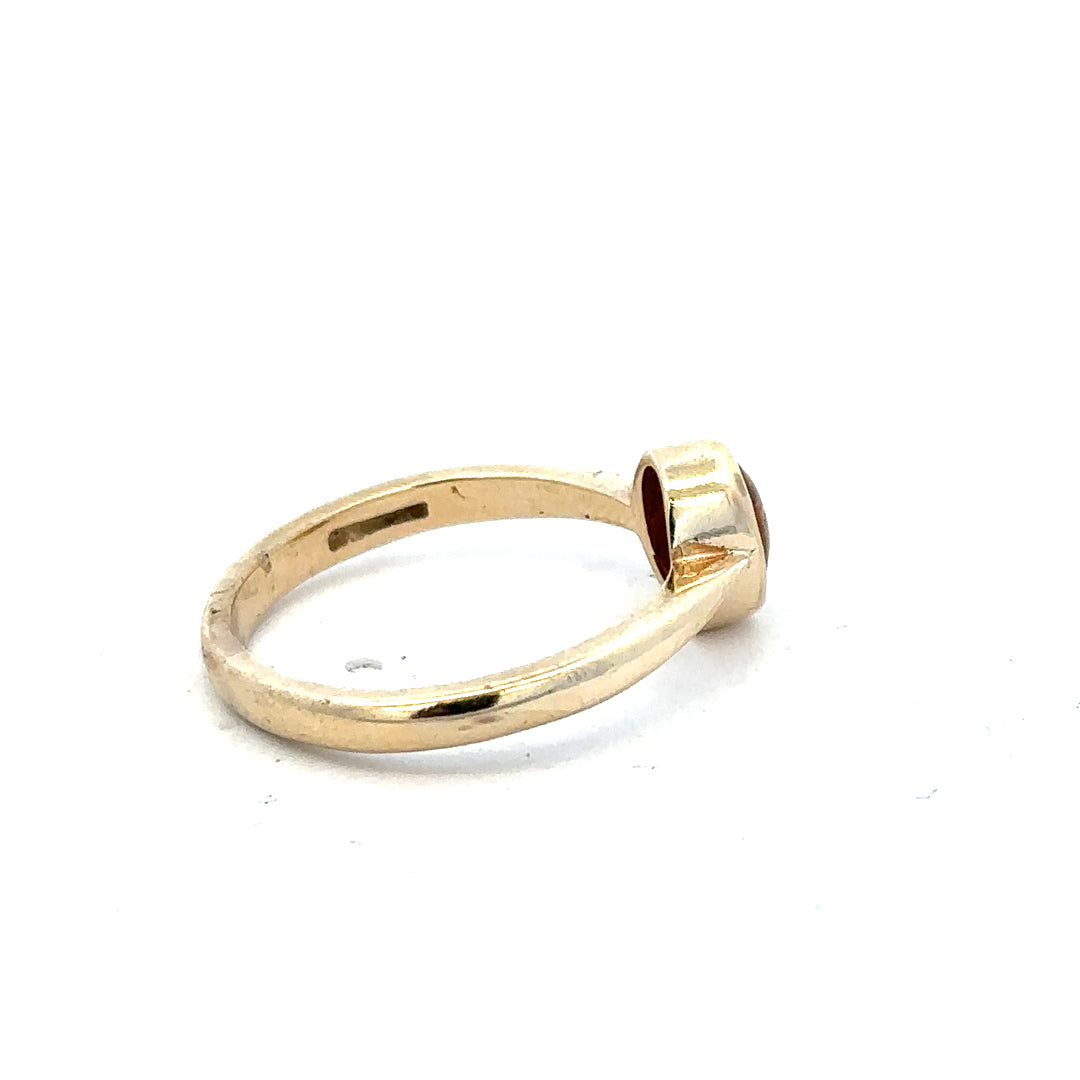 9ct yellow gold ring in size P with a smooth band, unbranded jewelry piece featuring a polished finish.